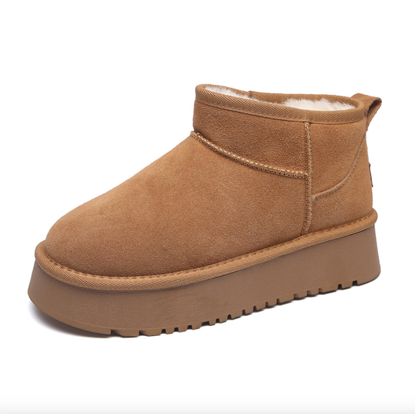 Tan suede ankle boot with a thick sole and soft lining, designed for comfort and style.